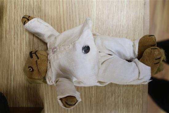 An early 20th century Bisque jointed doll with open mouth and sleeping eyes, and two small plush animals